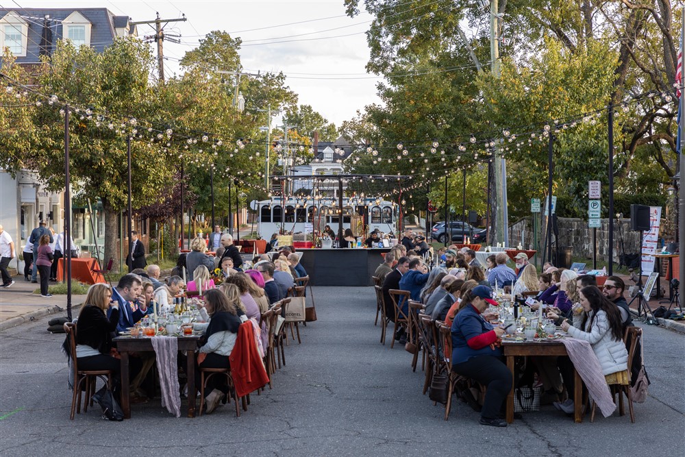 Image of people sitting at dinner tables on Charles Street from A Downtown Affair 2023.